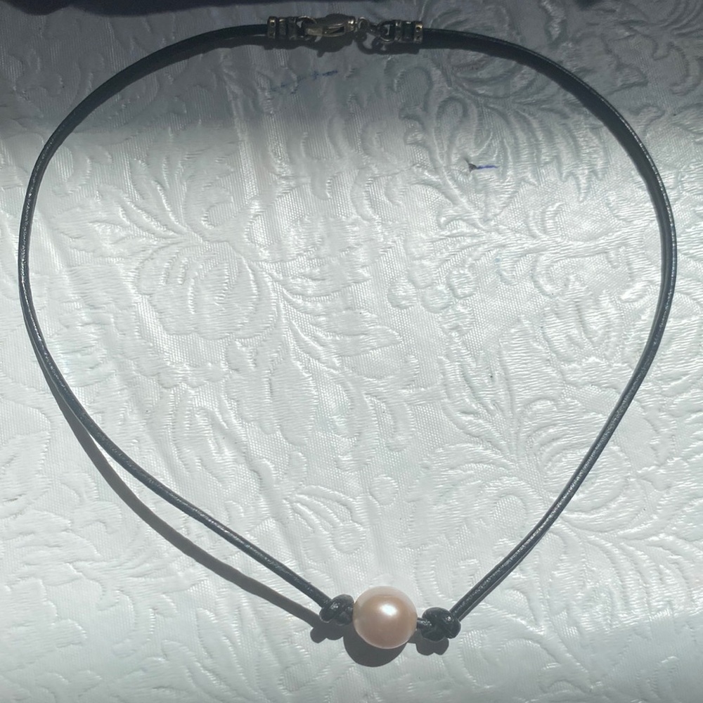 Single pearl necklace.